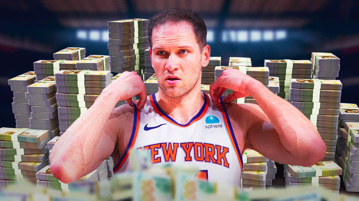 Bojan Bogdanovic surrounded by piles of cash.