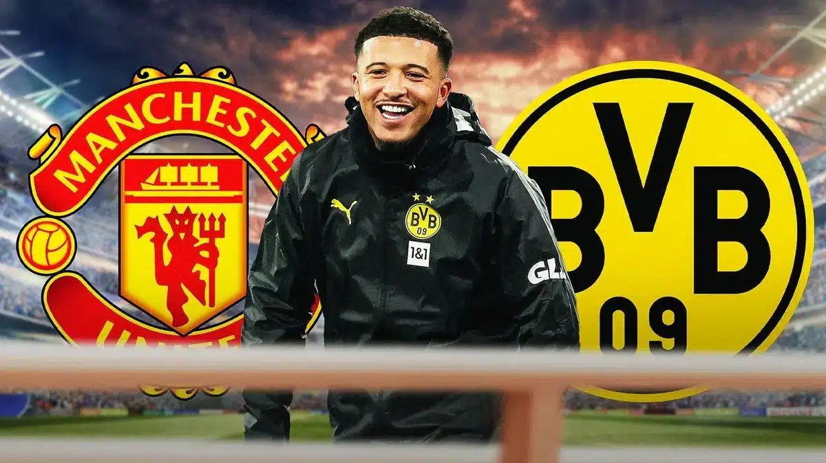 Jadon Sancho laughing inbetween the Manchester United and Borussia Dortmund logos