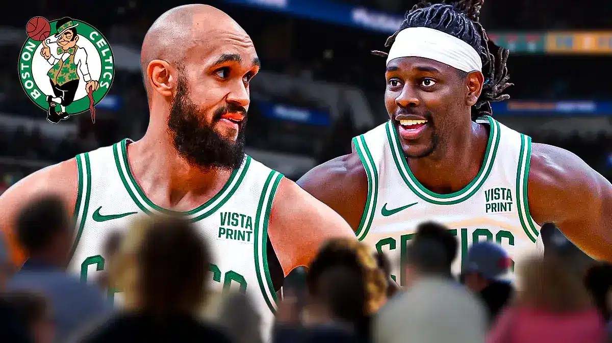 Derrick White and Jrue Holiday standing in front of Celtics logo before Heat game