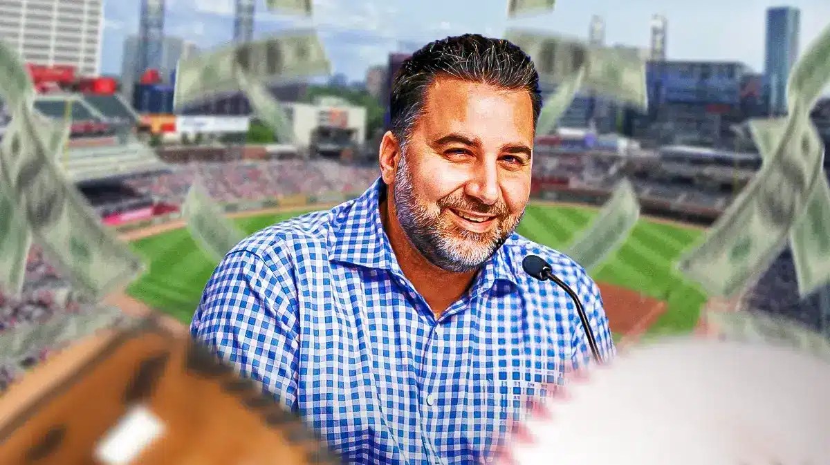 Braves' Alex Anthopoulos with money raining down around him.