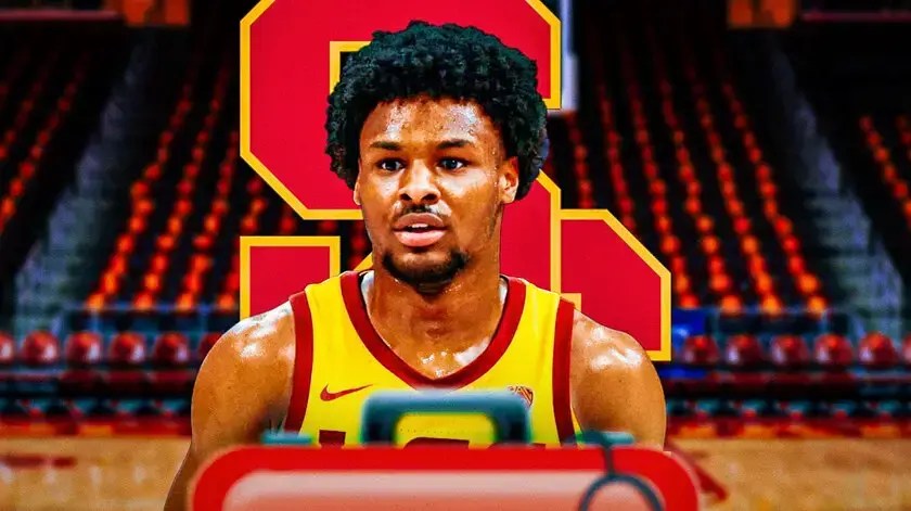 Photo: Bronny James in USC uniform with med kits and USC logo behind him