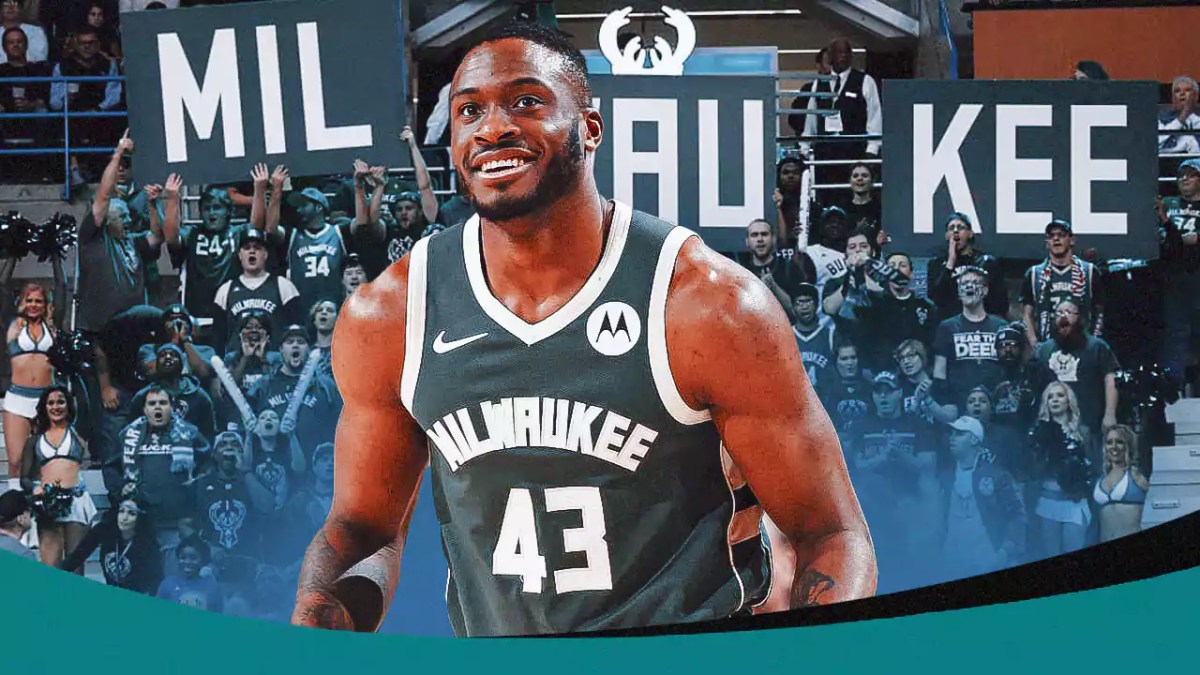 Thanasis Antetokounmpo with the Bucks arena in the background