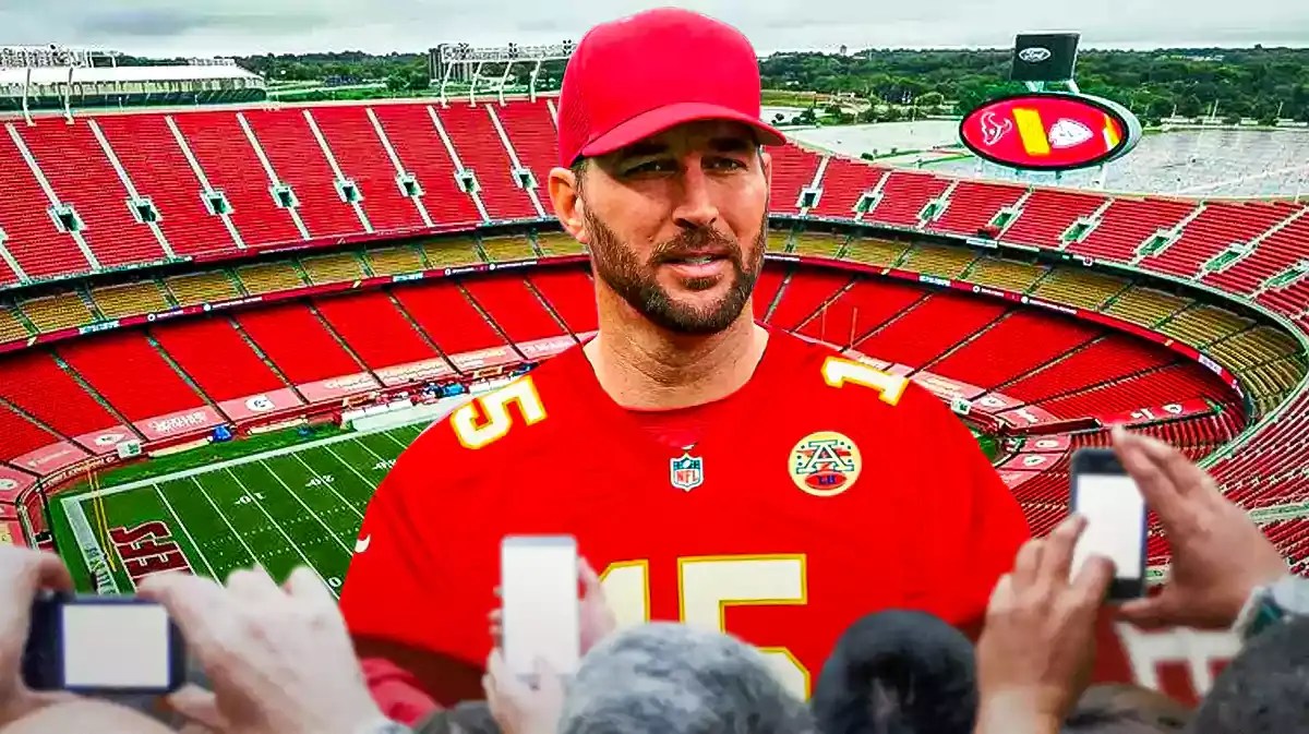 Photo: Adam Wainwright with Chiefs gear, Arrowhead stadium behind him with snow falling