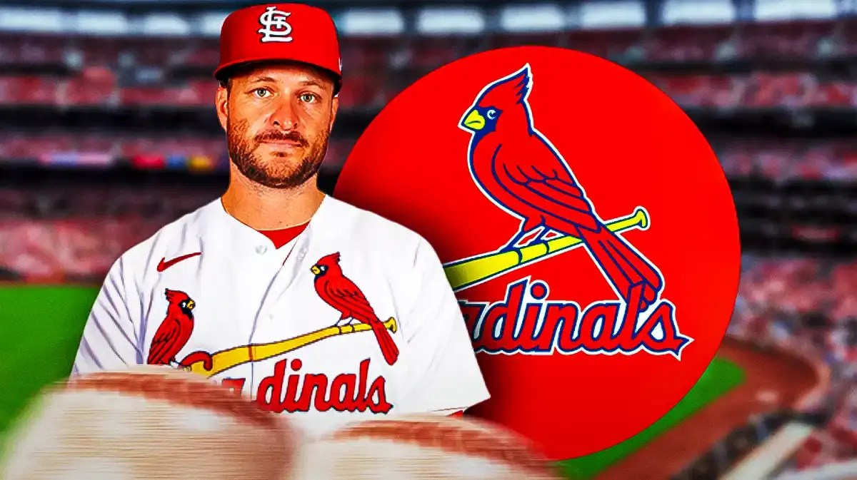 Ryan Brasier in a Cardinals uniform next to a Cardinals logo at Busch Stadium