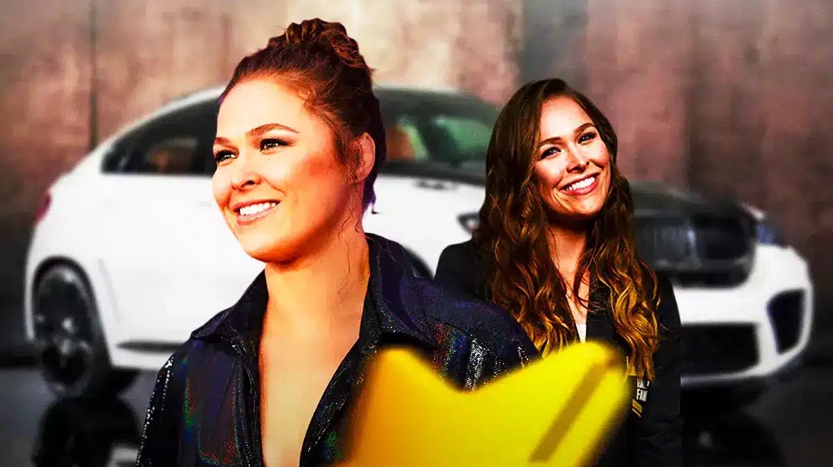 Ronda Rousey in front of a car from her collection.