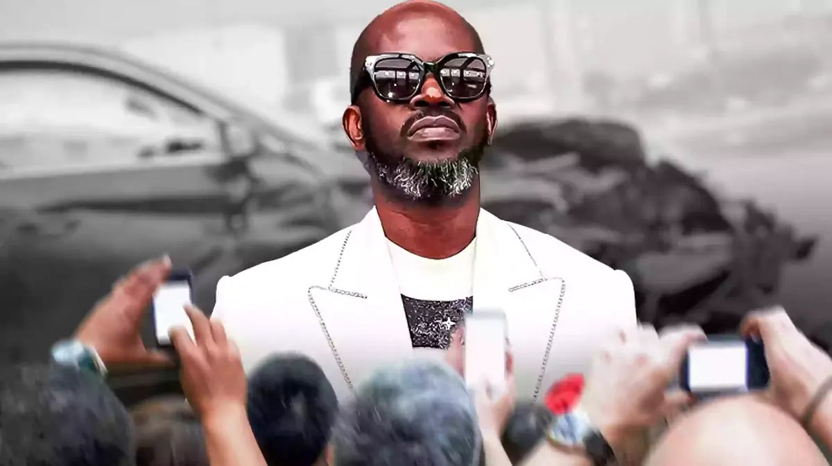 Black Coffee surrounded by reporters.