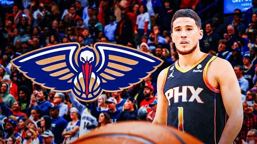 Photo: Devin Booker in Suns uniform with Pelicans logo and fans behind him