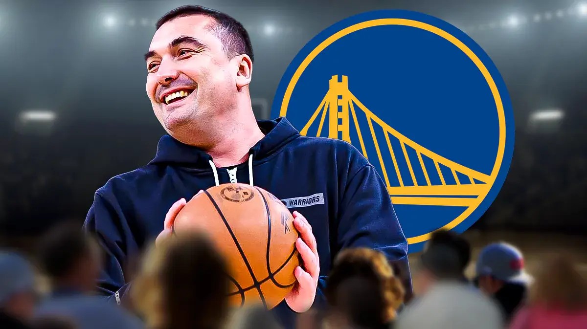 Dejan Milojevic smiling in front of Warriors logo before the Hawks game, Steve Kerr delivering a speech out of the frame