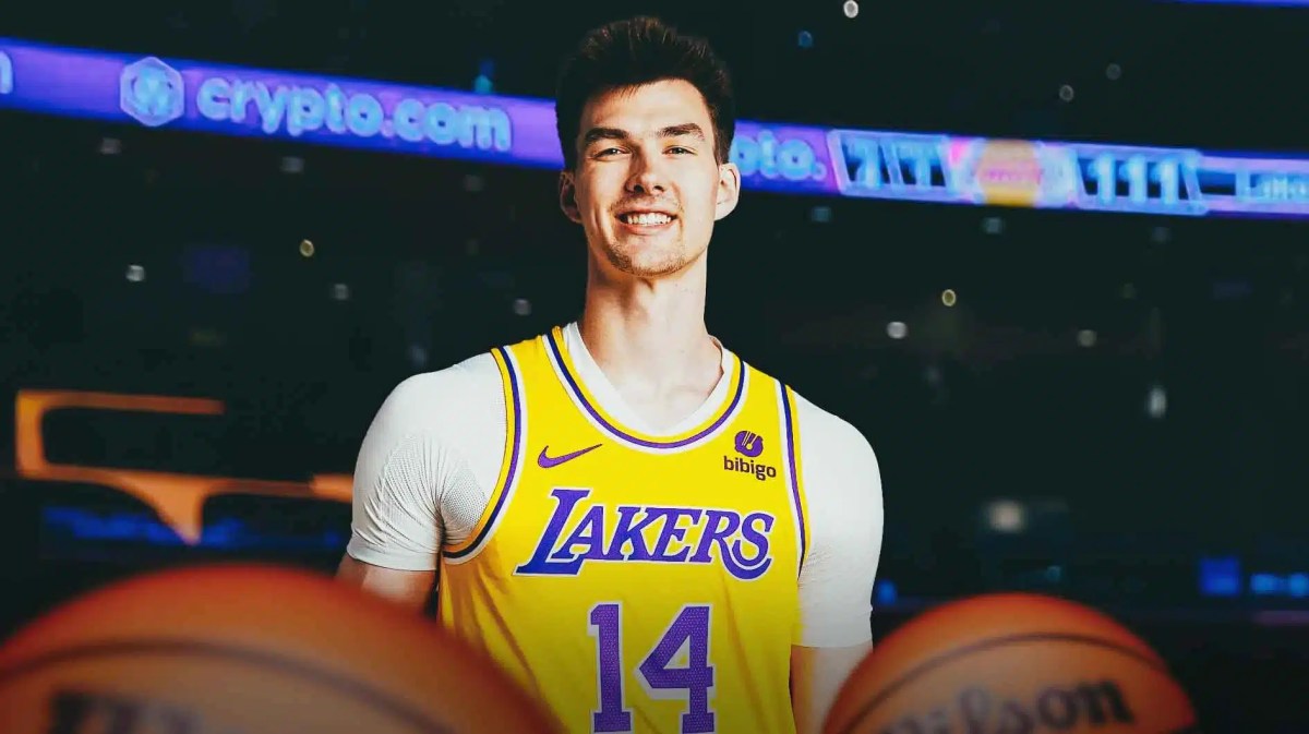 Colin Castleton in his Lakers jersey with the Lakers arena in the background