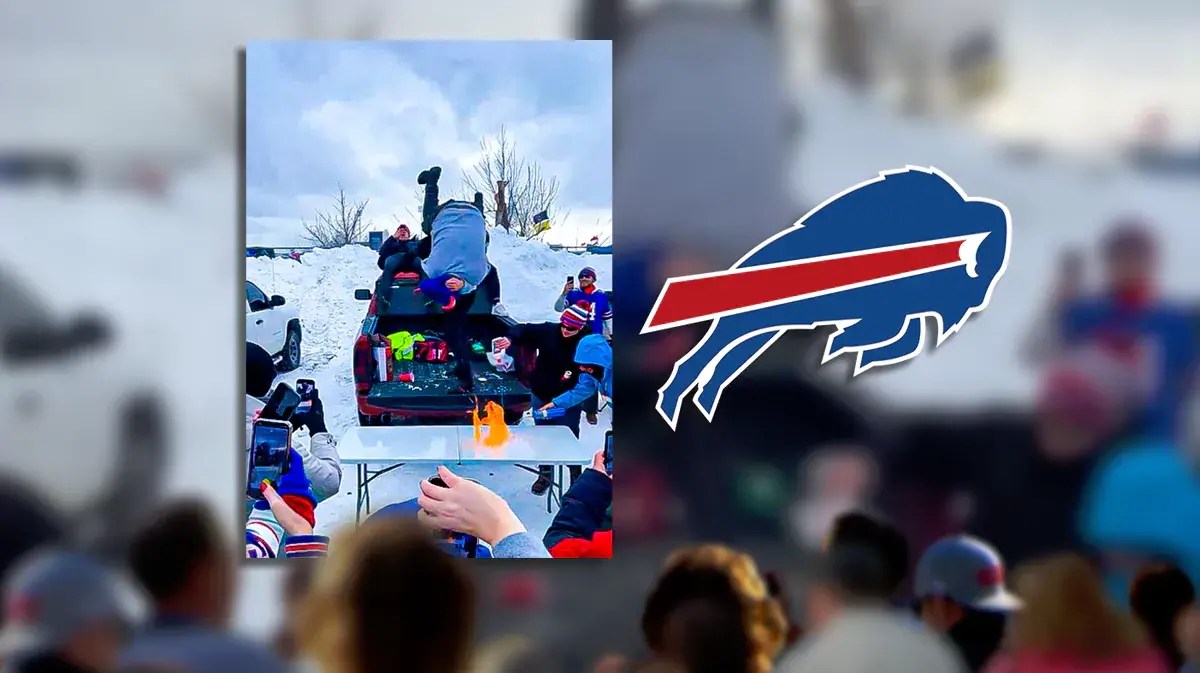 Bills fans tossing someone through a flaming table