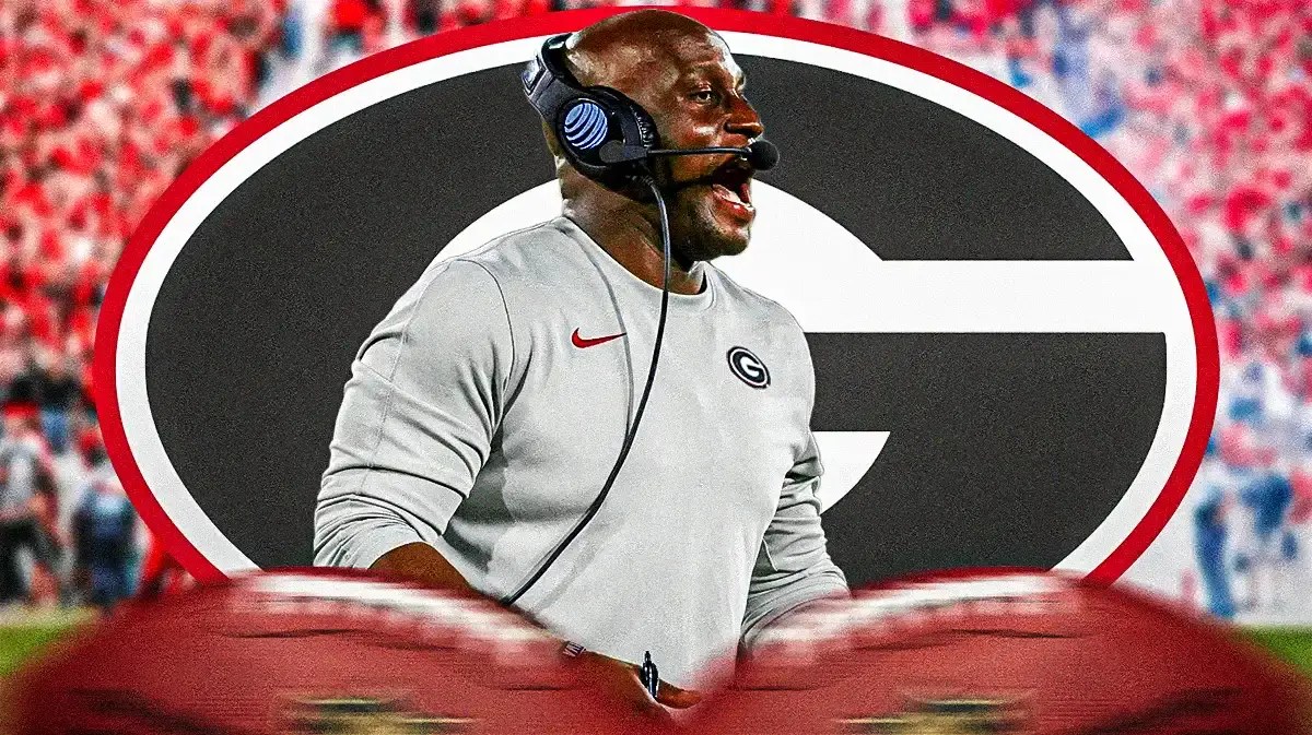 Photo: Travaris Robinson in Georgia gear with Bulldogs logo behind him