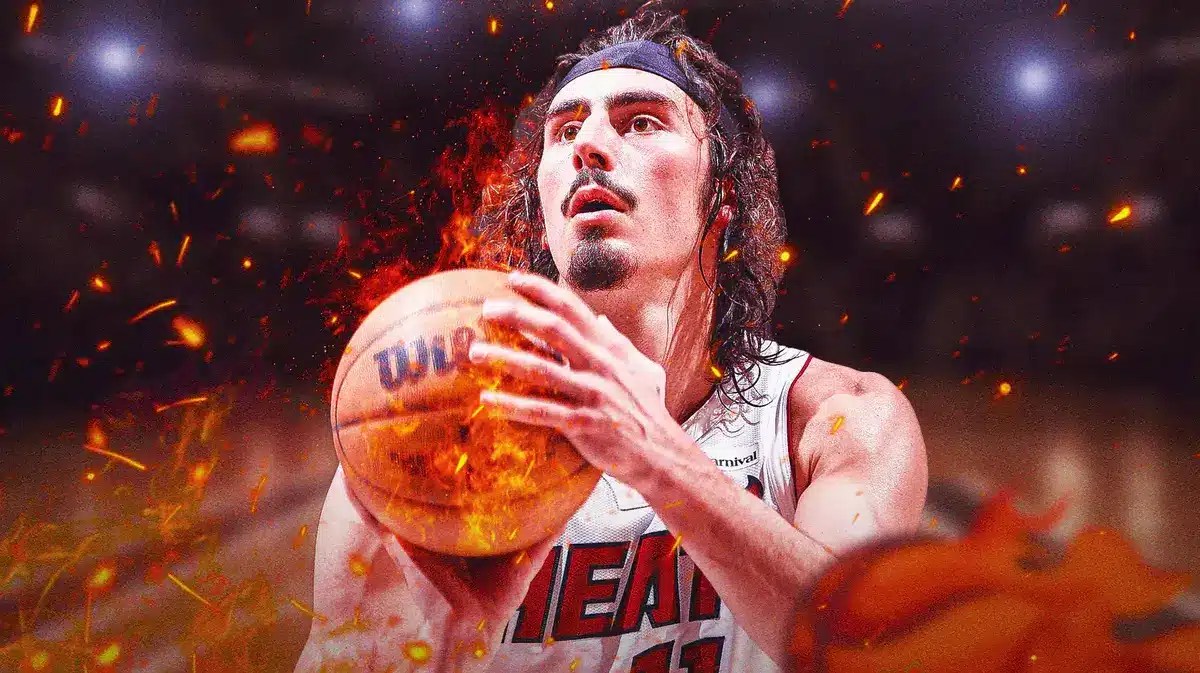 Miami Heat star Jaime Jaquez Jr. holding a ball on fire.