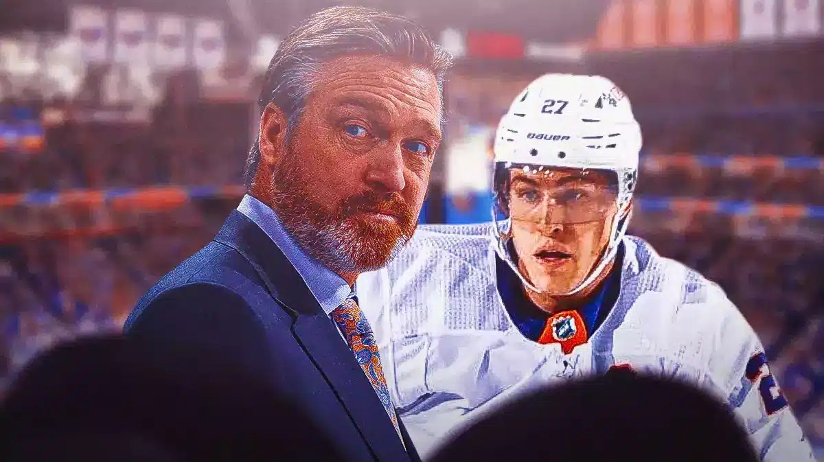 Islanders coach Patrick Roy with Anders Lee.