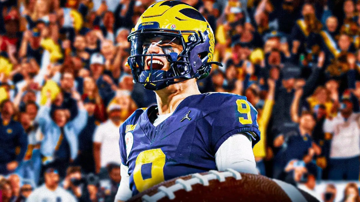 Michigan quarterback J.J. McCarthy excited in the foreground, fans cheering in the background.