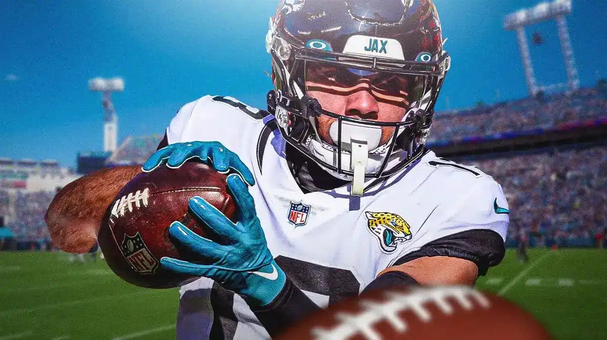 Jaguars' Christian Kirk catching a football.
