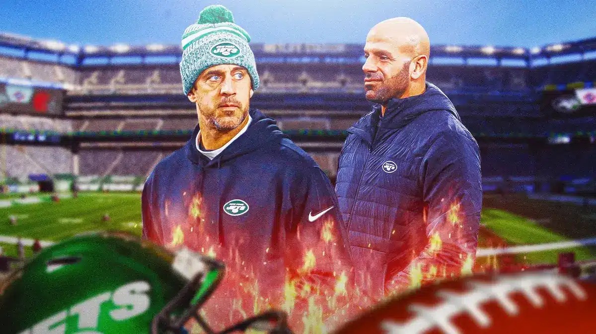 Aaron Rodgers next to Robert Saleh (New York Jets) Flames surrounding them