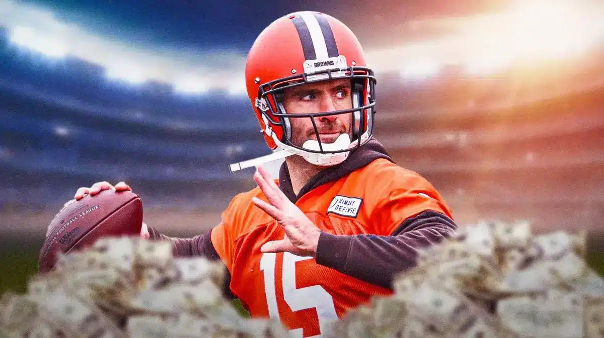 Joe Flacco with money around him.