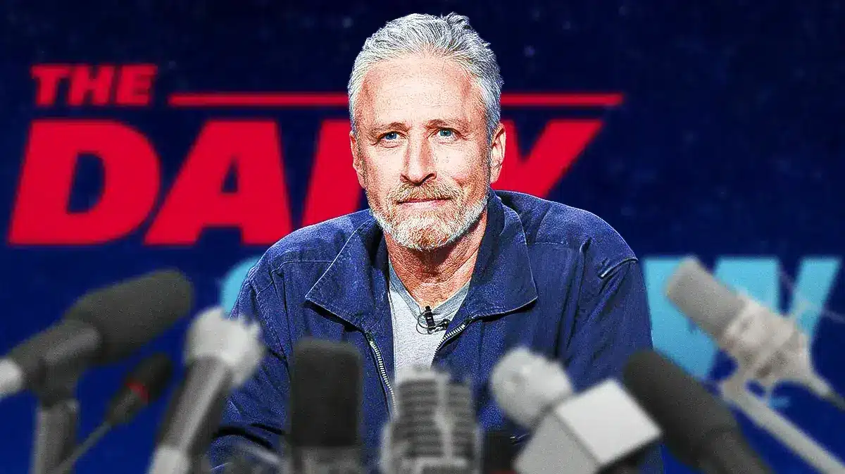 Jon Stewart now, with Daily Show imagery flanking him