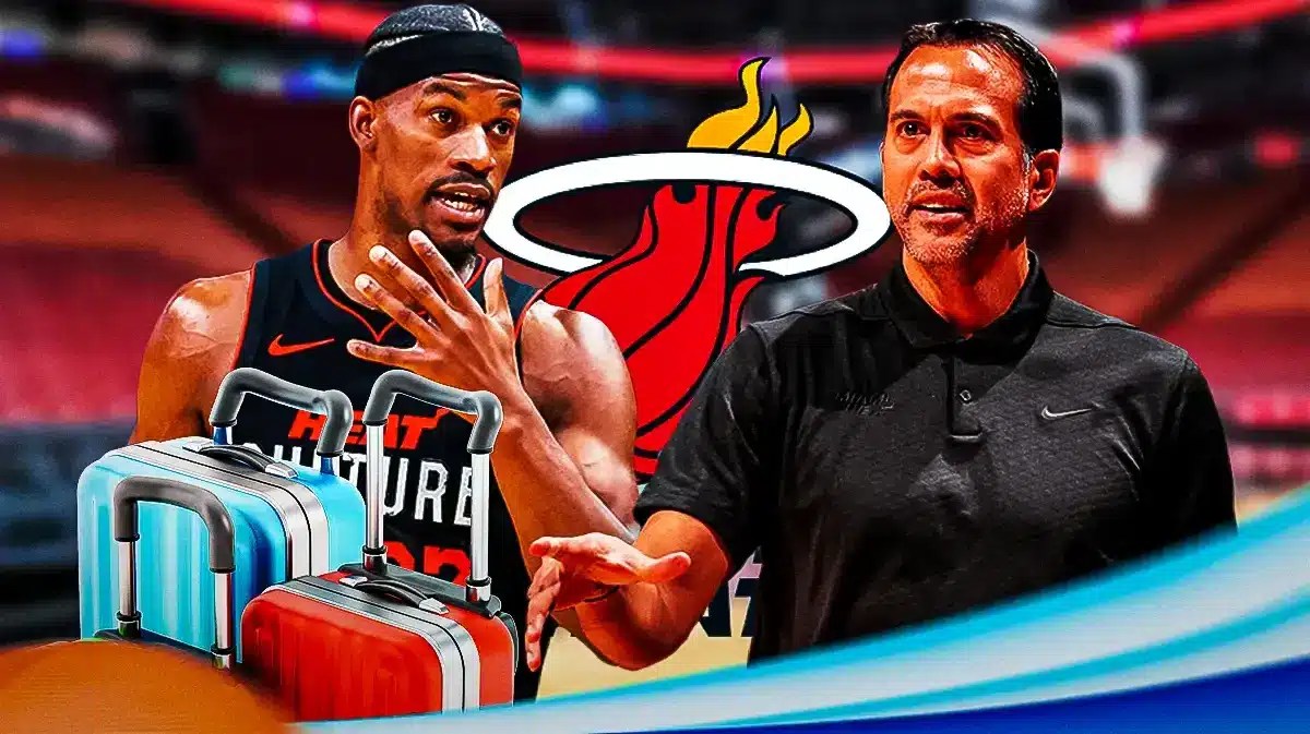 Photo: Jimmy Butler with packed bags and Erik Spoelstra in Heat gear with Heat logo behind them