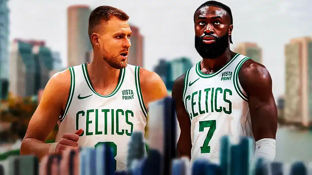 Jaylen Brown and kristaps Porzingis in celtics jerseys looking tough on a Boston city skyline background