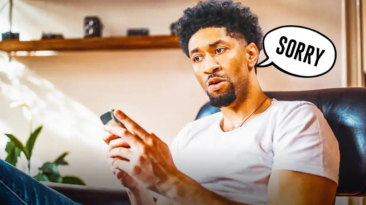 Lakers Christian Wood holding a phone and saying sorry