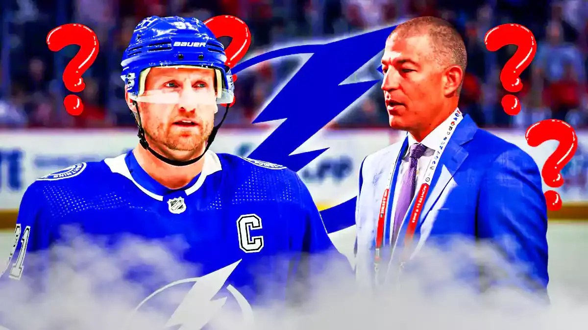 Steven Stamkos on one side looking stern, Julien BriseBois on other side, Tampa Bay Lightning logo in image, a few question marks, hockey rink in background