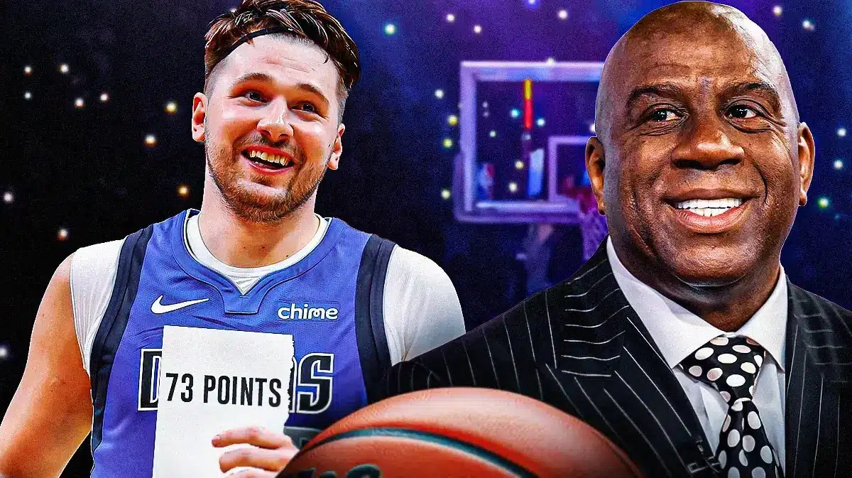 Photo: Magic Johnson in a suit with Luka Donic in Mavericks uniform holding his 73-point game paper