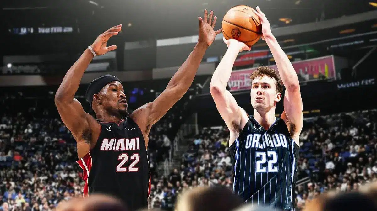 Magic F Franz Wagner scoring in the KIA Center vs Heat guard Jimmy Butler
