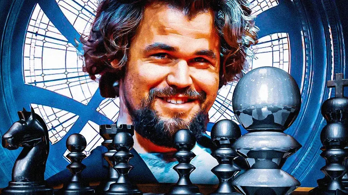 Magnus Carlsen sitting in front of a chess board