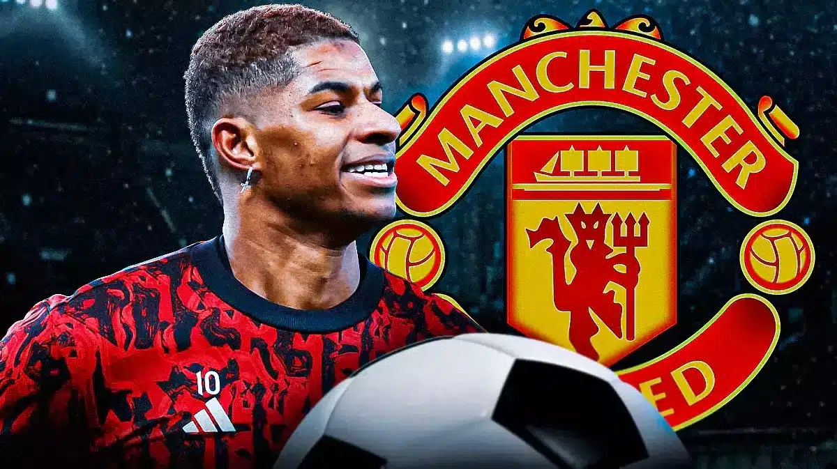 Marcus Rashford celebrating in front of the Manchester United logo