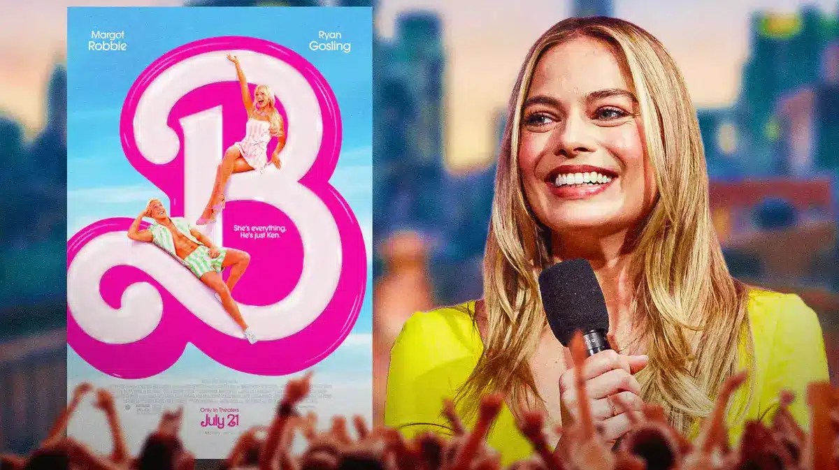 Margot Robbie with Barbie poster.