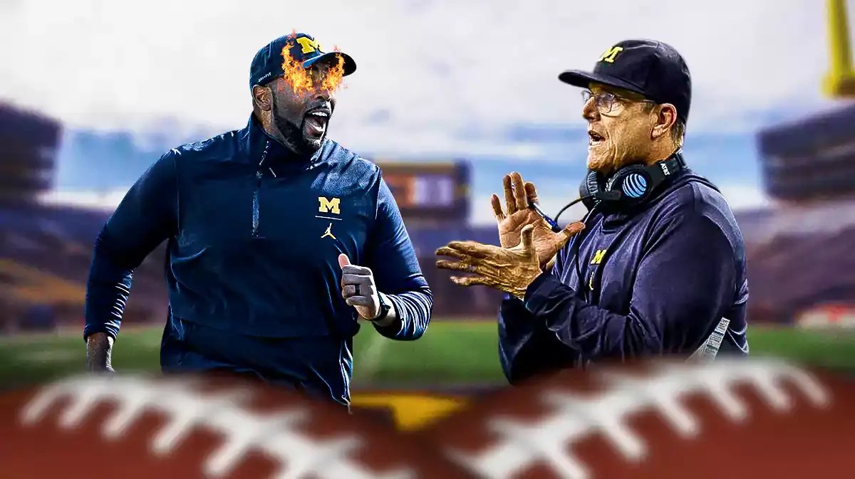 Michigan football coach Sherrone Moore with fire in his eyes. Jim Harbaugh clapping in the back