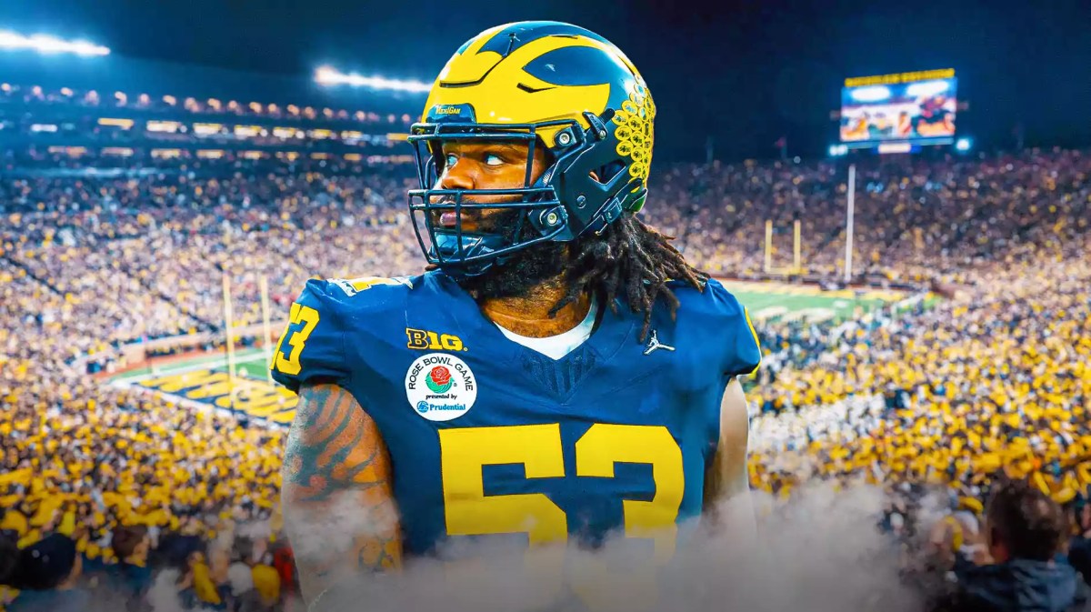 Michigan football, Wolverines, Trente Jones, Trente Jones Michigan, National championship, Trente Jones in Michigan uni with Michigan football stadium in the background
