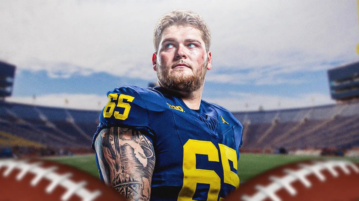 Michigan football, Wolverines, Zak Zinter, Zak Zinter Michigan, Zak Zinter NFL, Zak Zinter in Michigan uni with Michigan football stadium in the background