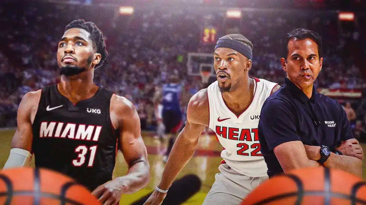 Heat’s Erik Spoelstra and Jimmy Butler looking at Donovan Mitchell in Heat uniform