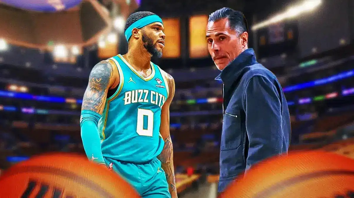 Lakers GM Rob Pelinka looking at Hornets forward Miles Bridges.