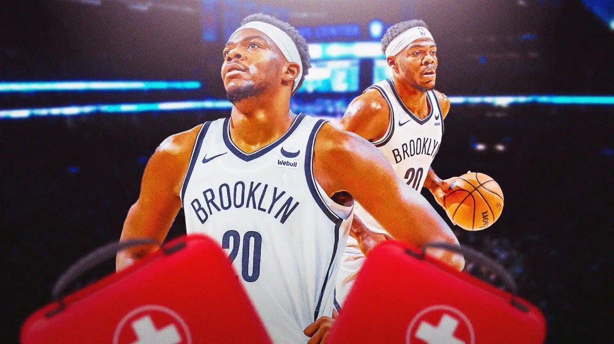 Nets' Day'Ron Sharpe with first aid kits