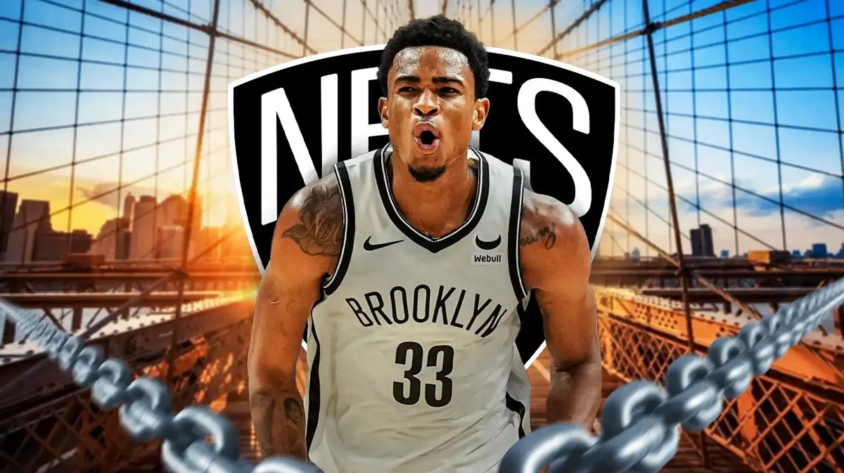 Nic Claxton flexes in front of Nets logo as he battles Timberwolves' Rudy Gobert and Karl-Anthony Towns