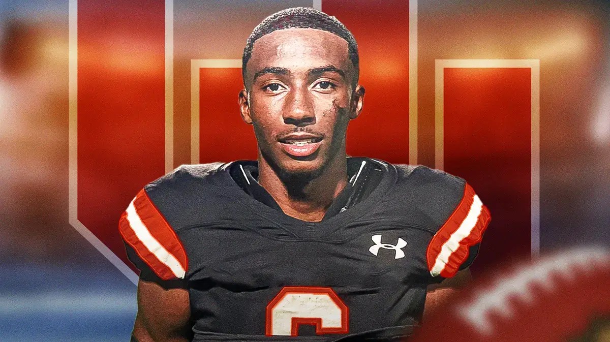 Photo: Cobey Sellers in Oklahoma Sooners gear with OU logo behind him