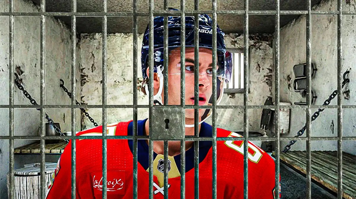 Florida Panthers forward Will Lockwood behind bars.