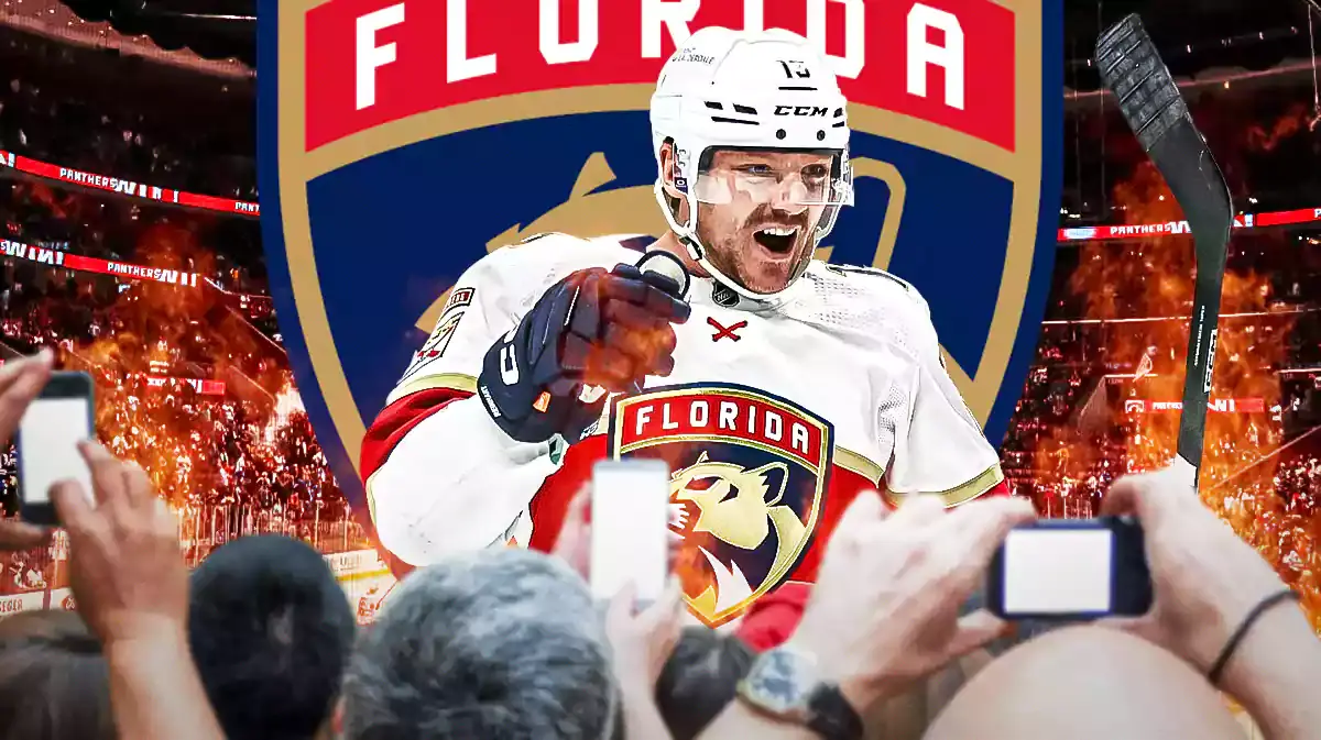 Sam Reinhart in middle of image looking happy, fire all around him, FLA Panthers logo, hockey rink in background