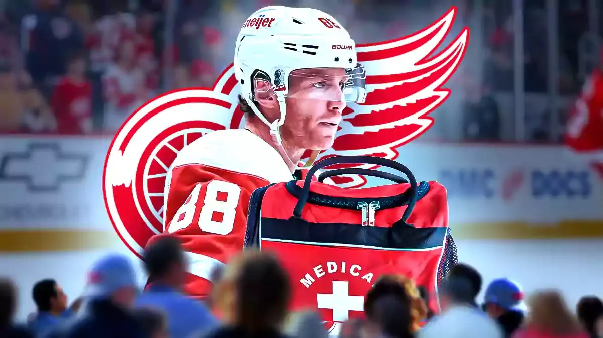 Patrick Kane in middle of image looking stern, first aid kit, DET Red Wings logo, hockey rink in background