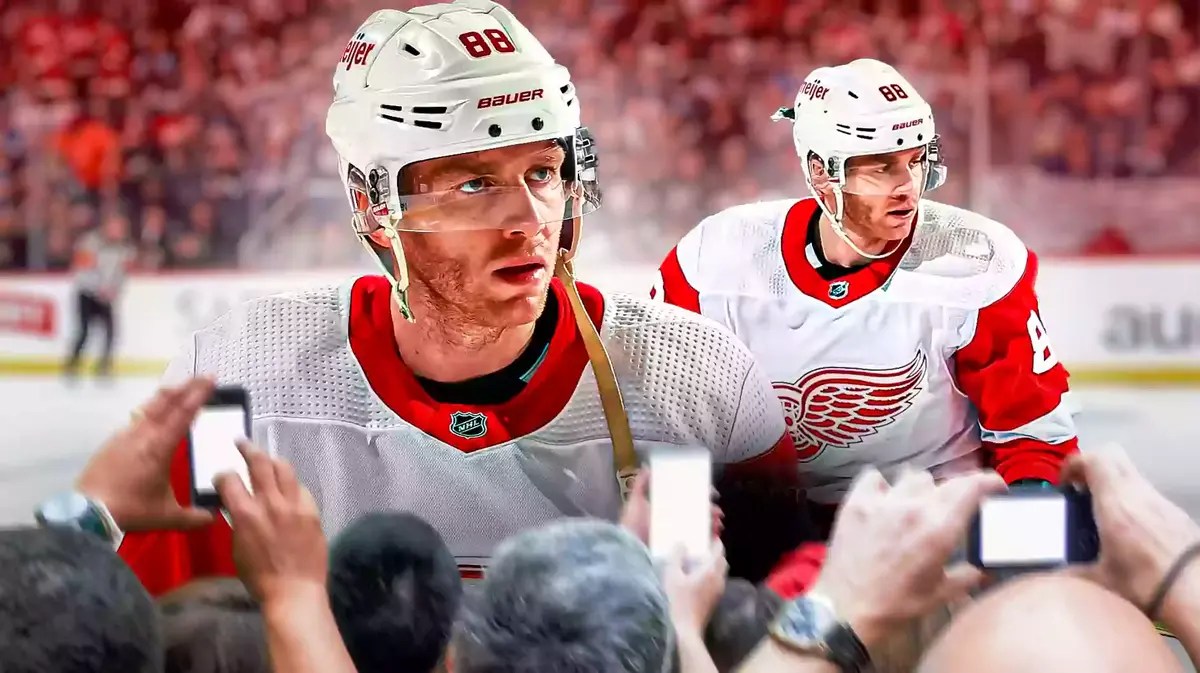 Red Wings' Patrick Kane in front looking serious. Red Wings' Patrick Kane in background playing hockey.