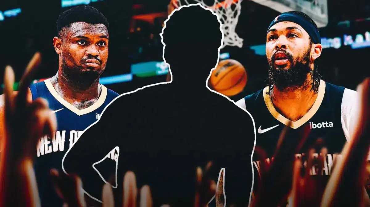 Zion Williamson and Brandon Ingram of Pelicans with mystery player between them. That mystery player is Malcolm Hill (action shot)