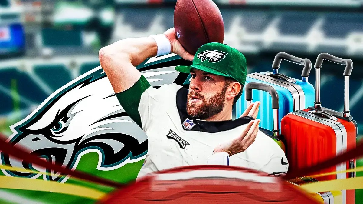 Photo: Alex Tanney in Eagles gear with Eagles logo behind him and luggage with him