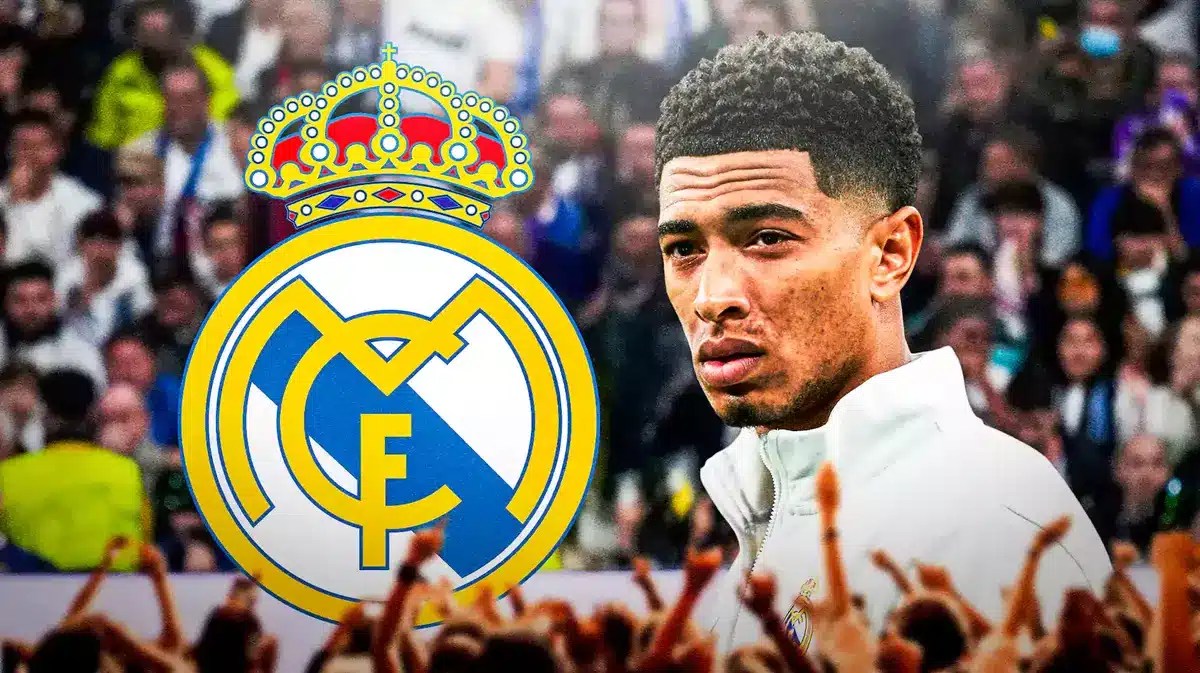 Jude Bellingham looking down/sad in front of the Real Madrid logo