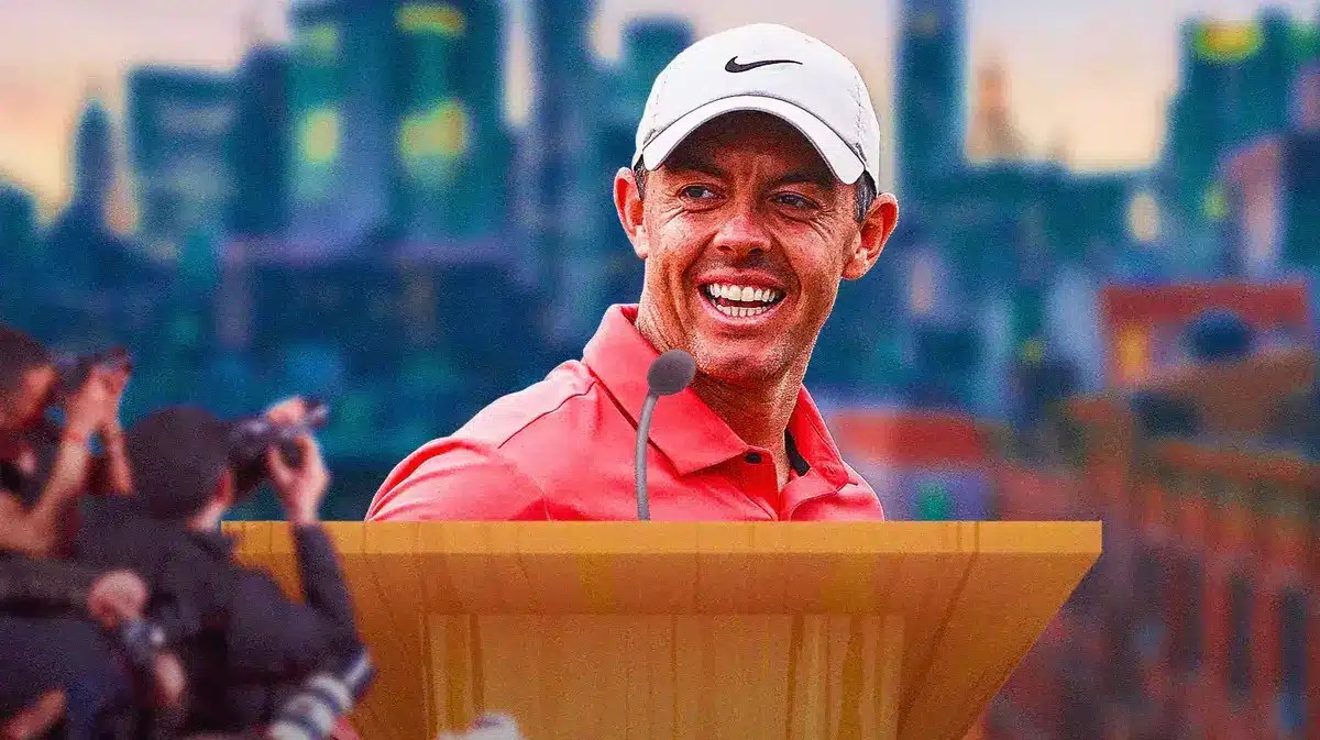 Rory McIlroy smiling at a podium