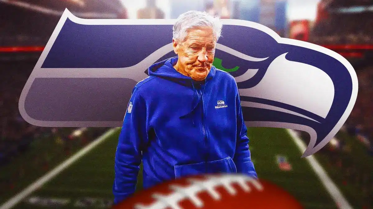 Seahawks Pete Carroll looking sad or upset next to a Seahawks logo. Background is Lumen Field, thanks