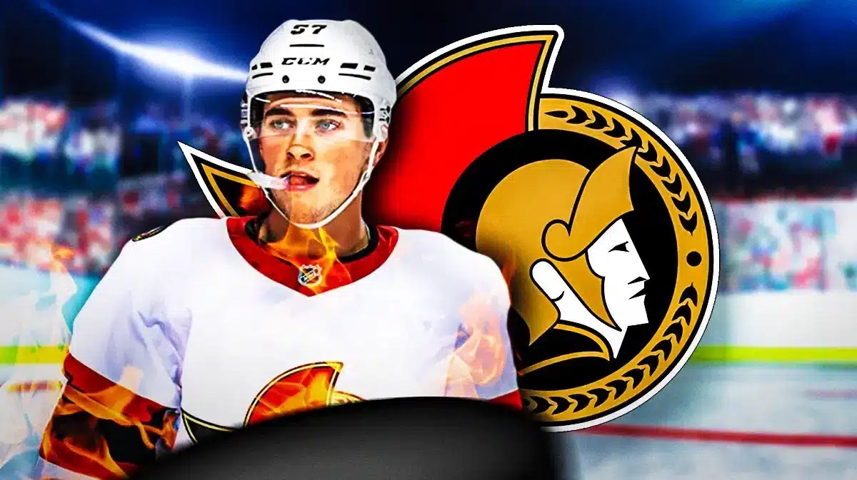 Shane Pinto in middle of image looking happy with fire around him, OTT Senators logo, hockey rink in background