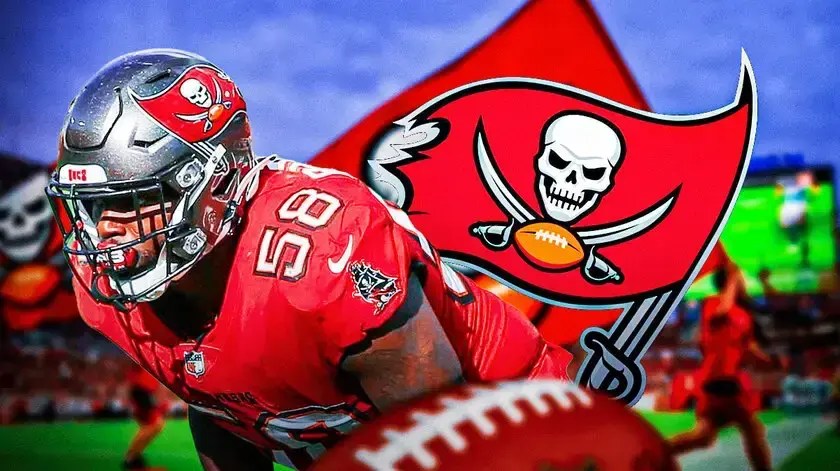 Shaq Barrett next to a Buccaneers logo in front of Raymond James Stadium